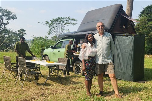 Nick and Patrah in front of their Toyota Hilux during camping in Uganda.