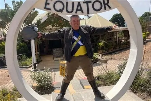 Simon on Moto Tour Uganda at the Equator in Uganda.