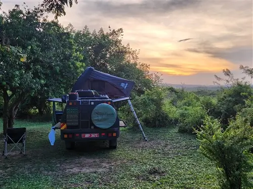 The Toyota Hilux Overland Camping Truck in Red Chilli in Murchison Falls National Park, Uganda.