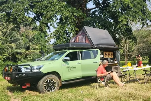 Team of Meanda Uganda in front of the Hilux Overland Camping truck.